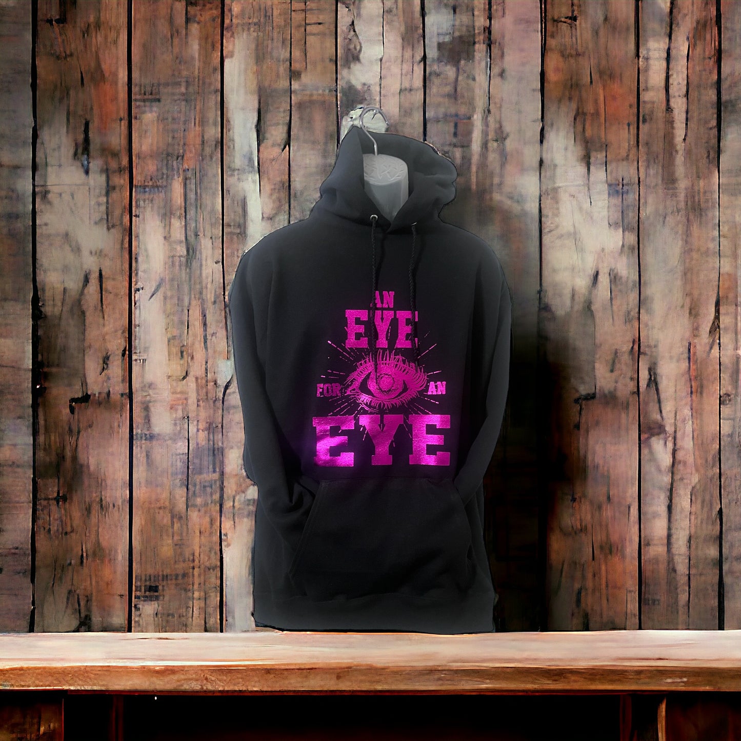 AN EYE FOR AN EYE HOODED SWEATSHIRT