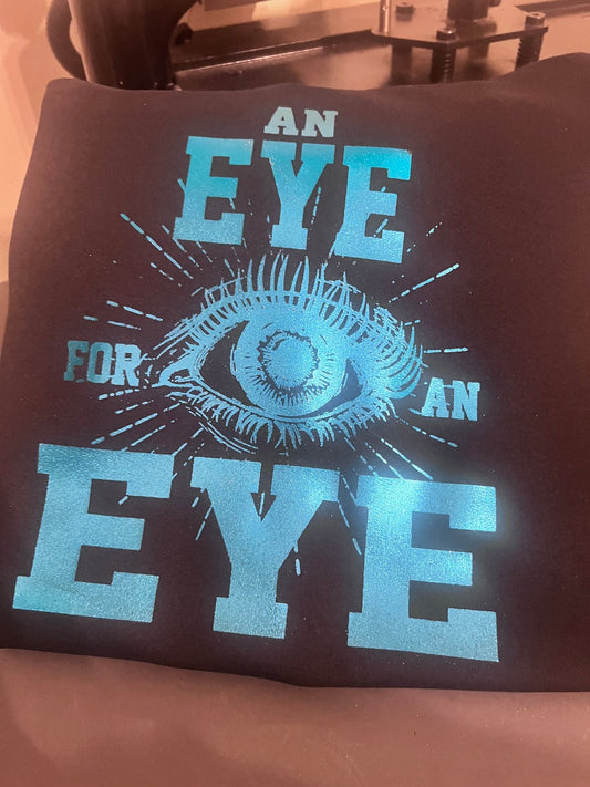 AN EYE FOR AN EYE HOODED SWEATSHIRT